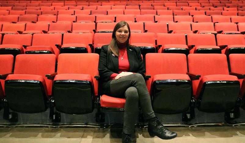 Tammy Koolbeck seated inside of Stephens Auditorium, Ames, Iowa.