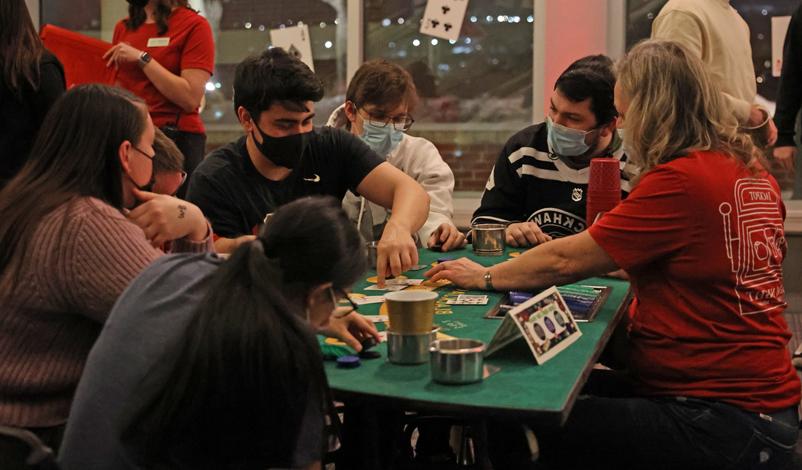 Students playing at a card table