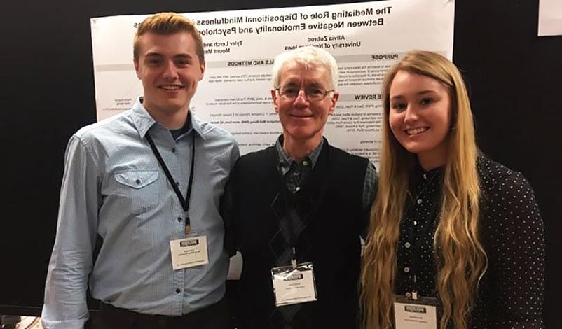 Alivia Zubrod (left), Dr. Ron Feldt (middle), and Tyler Lerch (right) at a conference.